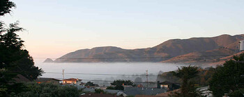 Northern California Pacific Marine Layer. The marine layer snuck in unusually low and level around sunset this evening. The marine layer of cloud/fog forms immediately above the cold Pacific ocean water, the warmer air above that layer acts like a seal, and keeps the air below it from mixing and dispersing.