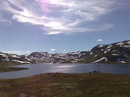 Haukelifjell in Vinje in Norway - July, summer of 2008. Visited Haukelifjell last month. This area is beautiful. No trees here as you can see, as this area is above the tree line. If you move just a bit north you'll reach Hardangervidda National Park, northern Europe's highest mountain plateau. This image was captured with my Nokia N82 cellphone (5 MP) and just resized on the computer without any additional image optimization.
