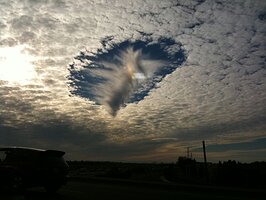 Good example of a fallstreak hole - http://en.wikipedia.org/wiki/Fallstreak_hole